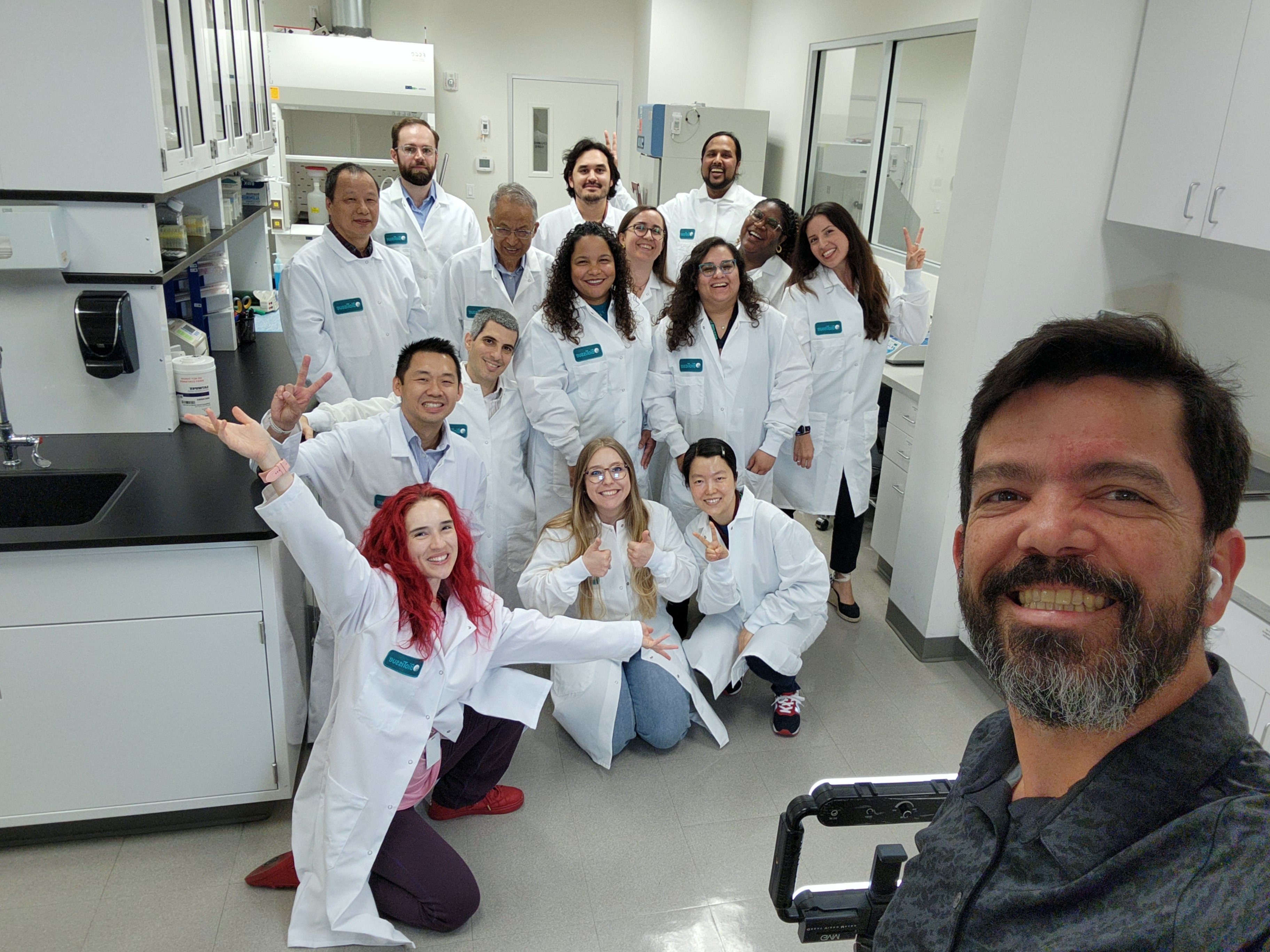 Kristy and the BioTissue R&D Team in white labcoats
                              in a clean, beautiful lab, smiling.